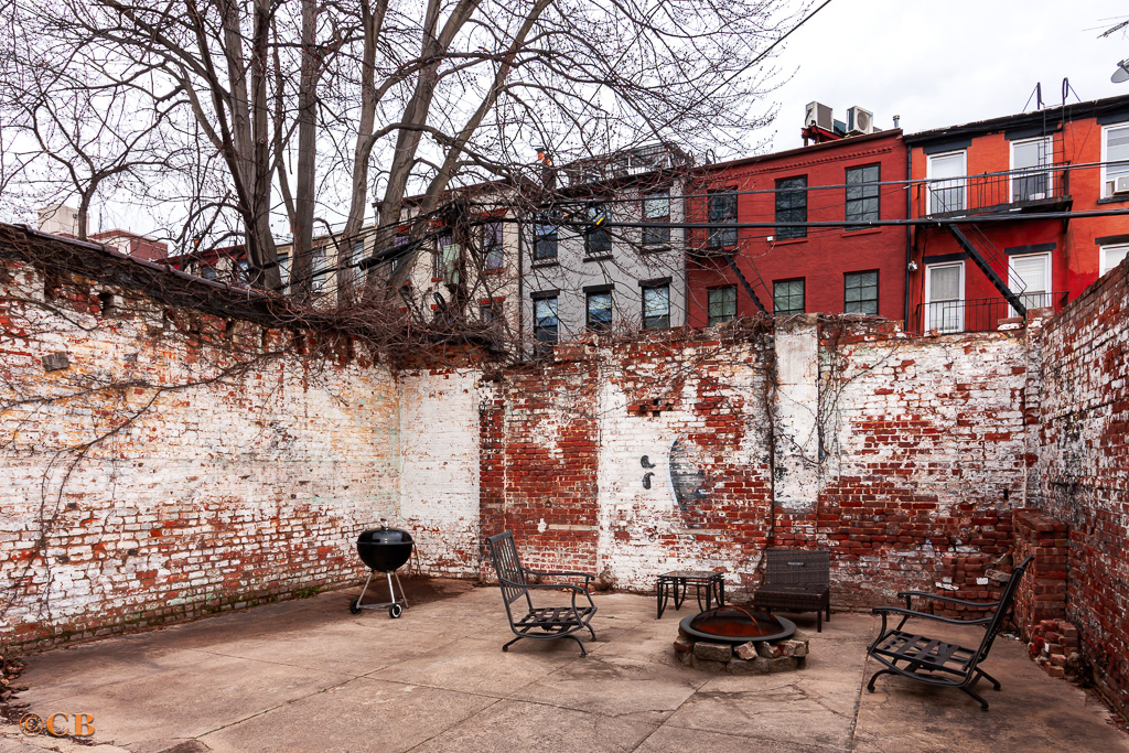 149 Van Buren Street, Unit GARDEN Brooklyn, NY 11221 - Photo 5 of 6 a view of a brick building with many windows