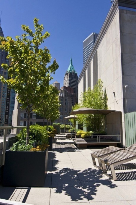 99 John Street, Unit 813 Manhattan, NY 10038 - Photo 12 of 20 a building with trees in front of it