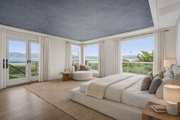 a bedroom with furniture and large windows