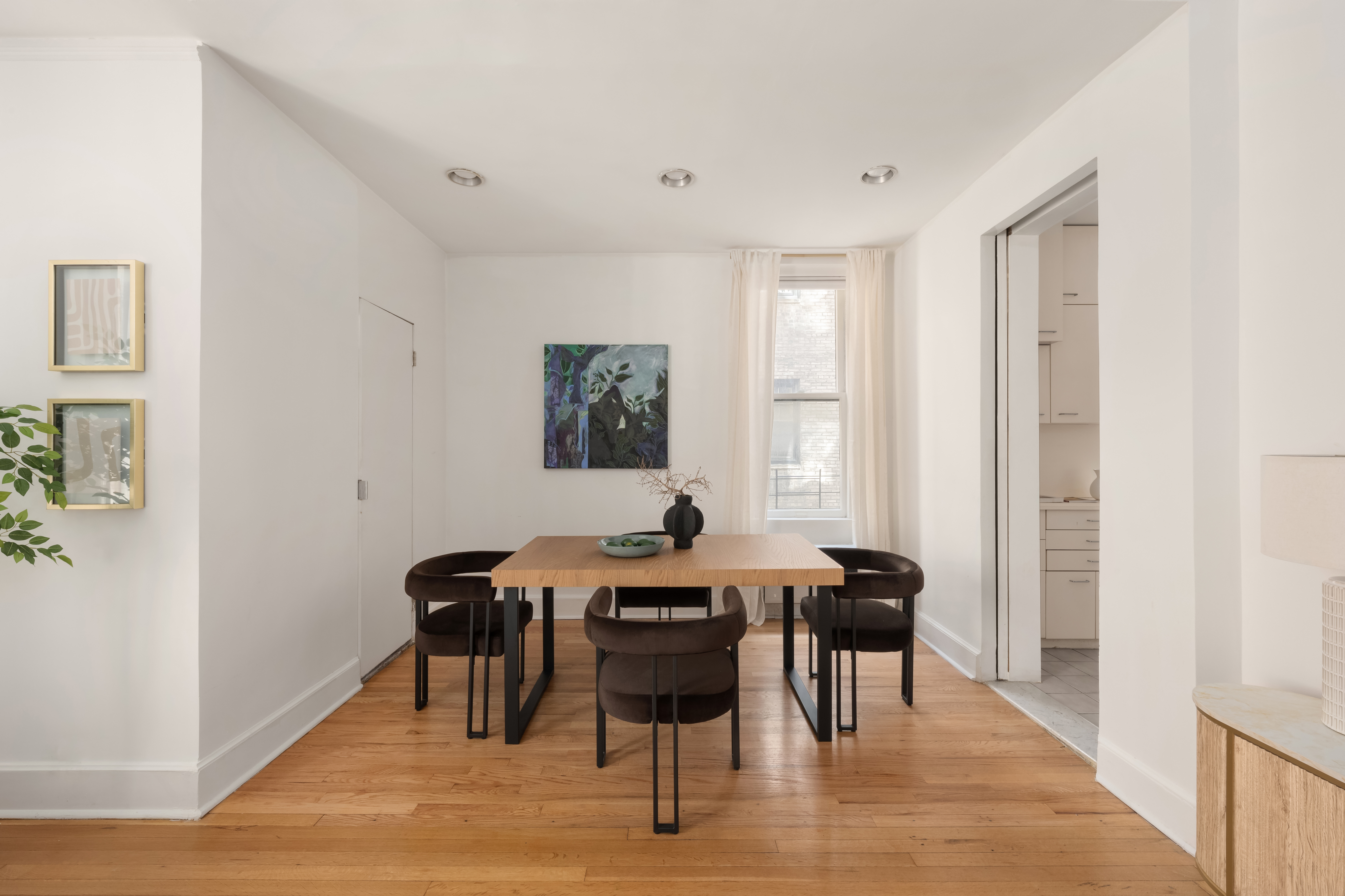 1060 Park Avenue, Unit 11A Manhattan, NY 10128 - Photo 5 of 12 a view of a a dining room with furniture window and wooden floor