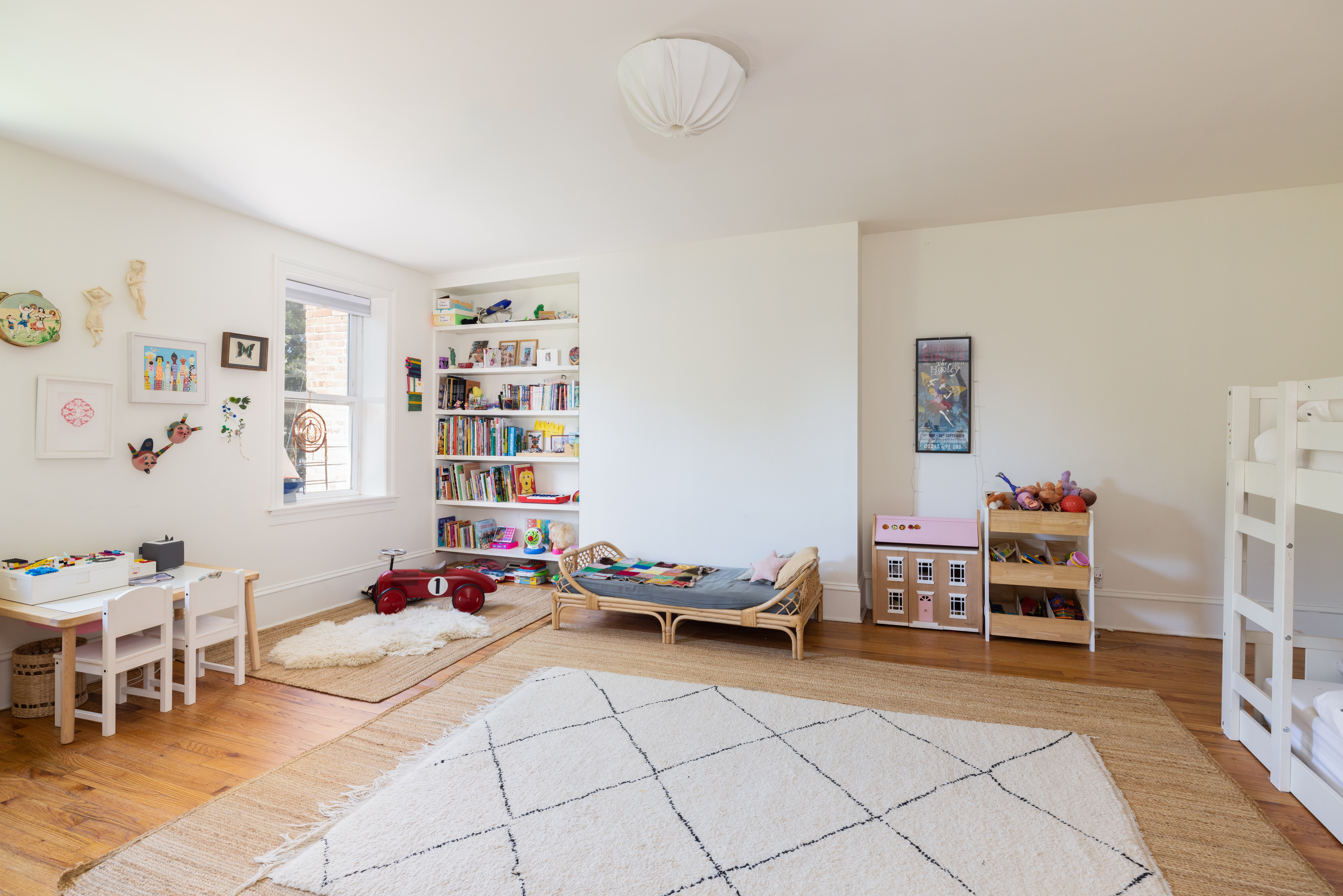 188 Warren Street, Unit TRIPLEX Brooklyn, NY 11201 - Photo 10 of 15 a bedroom with furniture and a book shelf