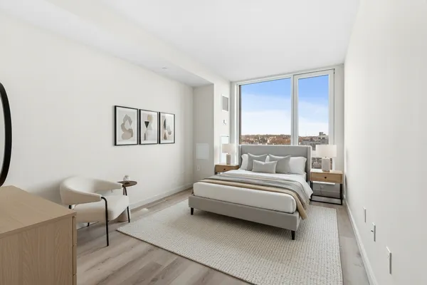 a bed room with a bed and a window