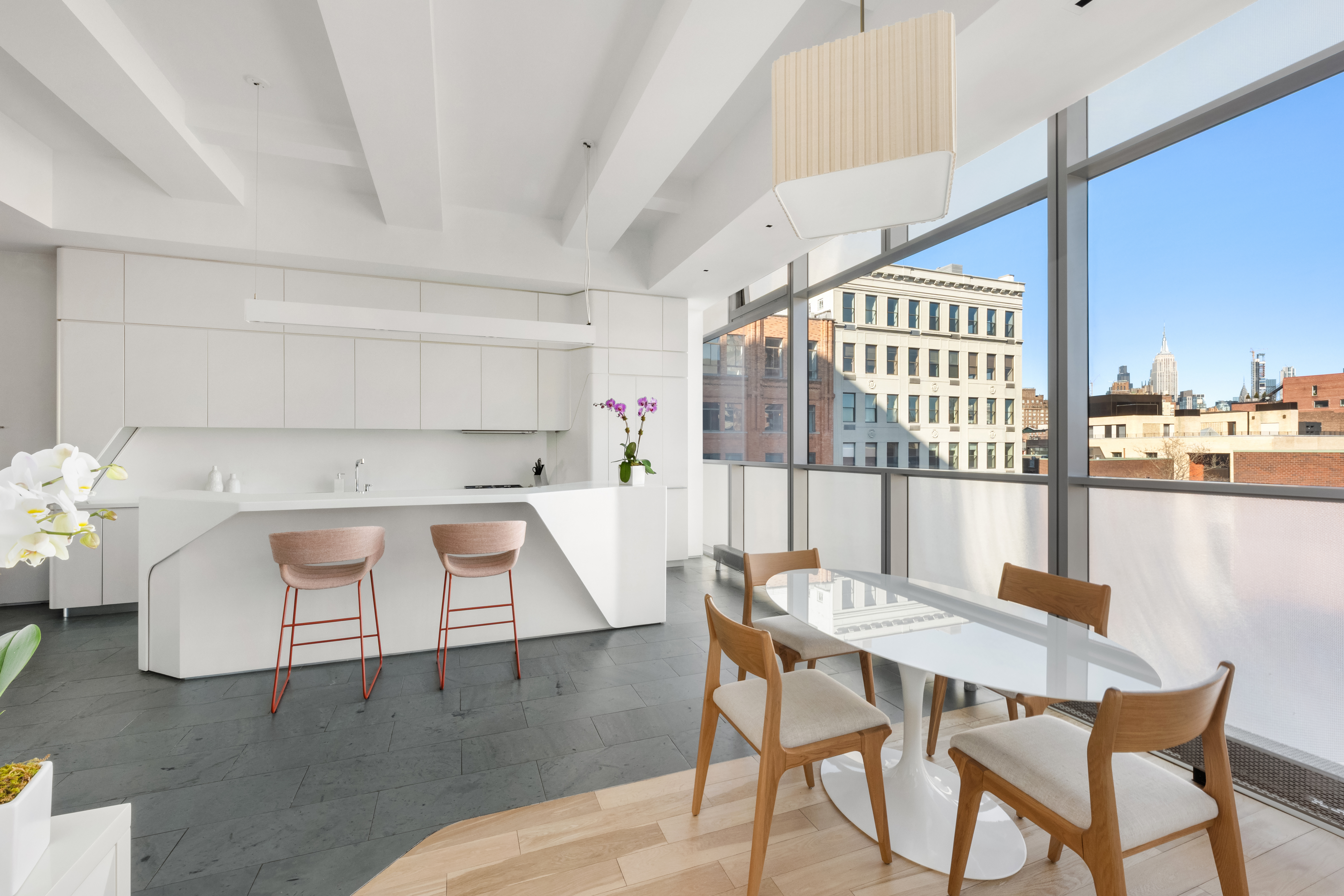 166 Perry Street, Unit 6B Manhattan, NY 10014 - Photo 5 of 17 a view of a dining room with furniture and wooden floor