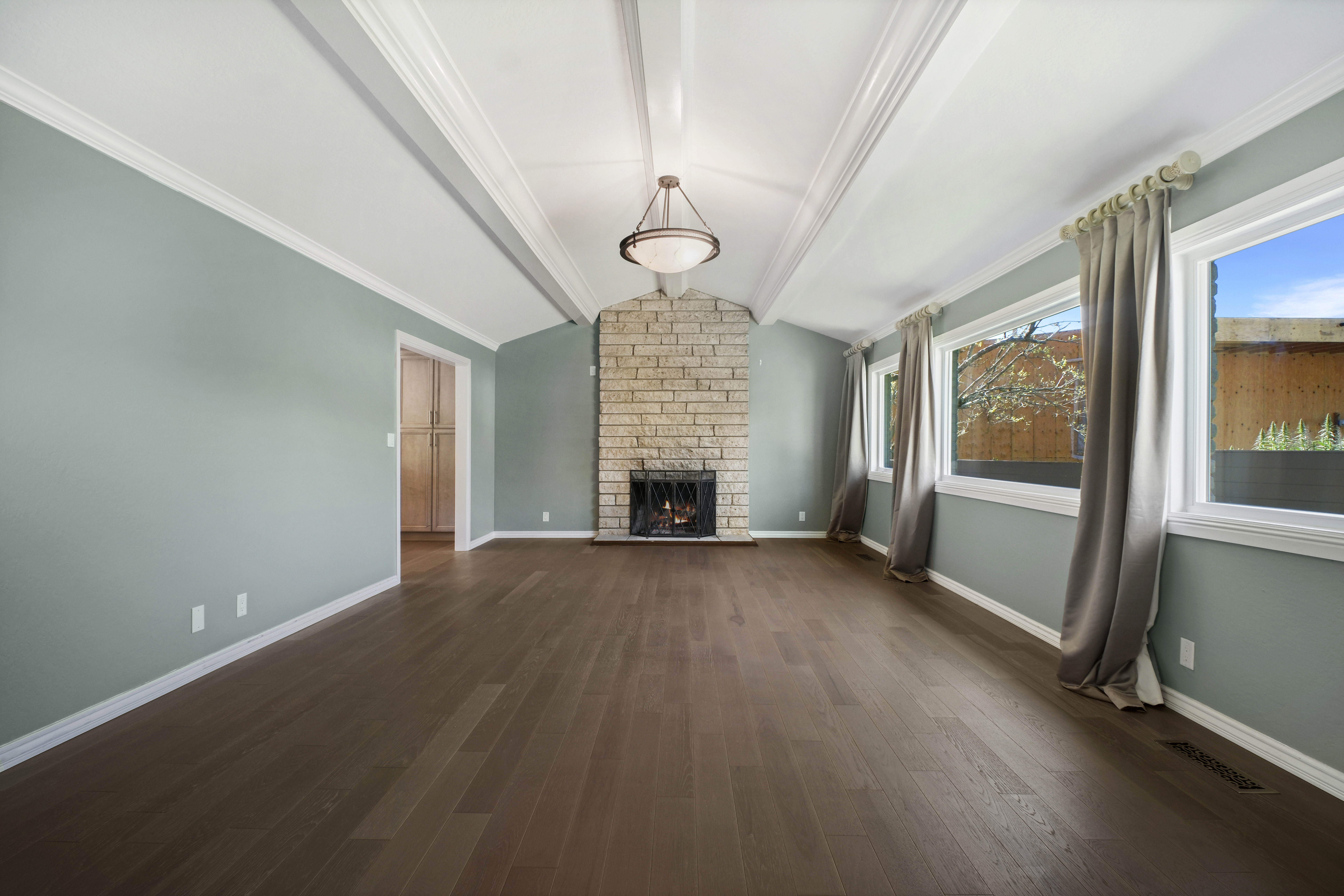 62 Oakdale Avenue San Rafael, CA 94901 - Photo 17 of 32 an empty room with wooden floor fireplace and windows