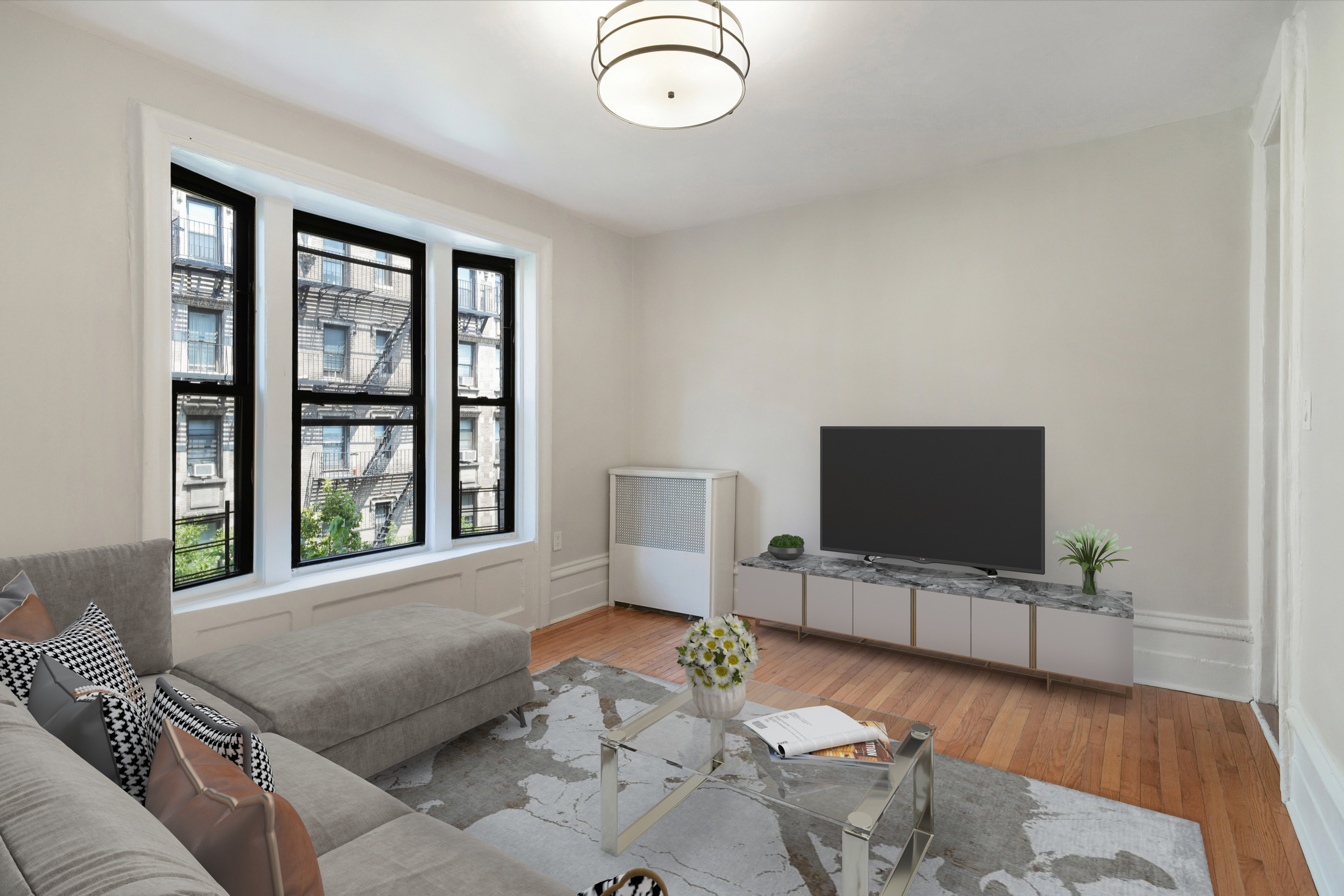 200 West 109th Street, Unit C1 Manhattan, NY 10025 - Photo 2 of 16 a living room with furniture and a flat screen tv