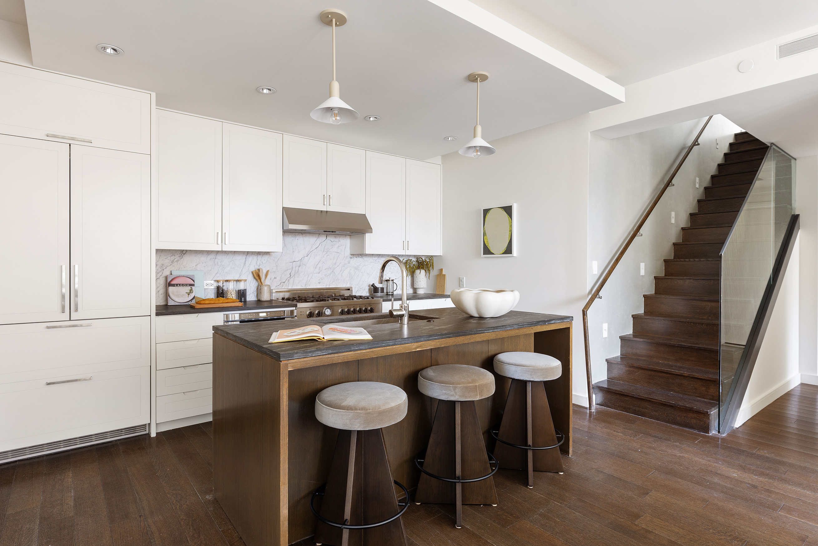 345 Carroll Street, Unit 4B Brooklyn, NY 11231 - Photo 3 of 16 a kitchen with a table chairs stove and cabinets
