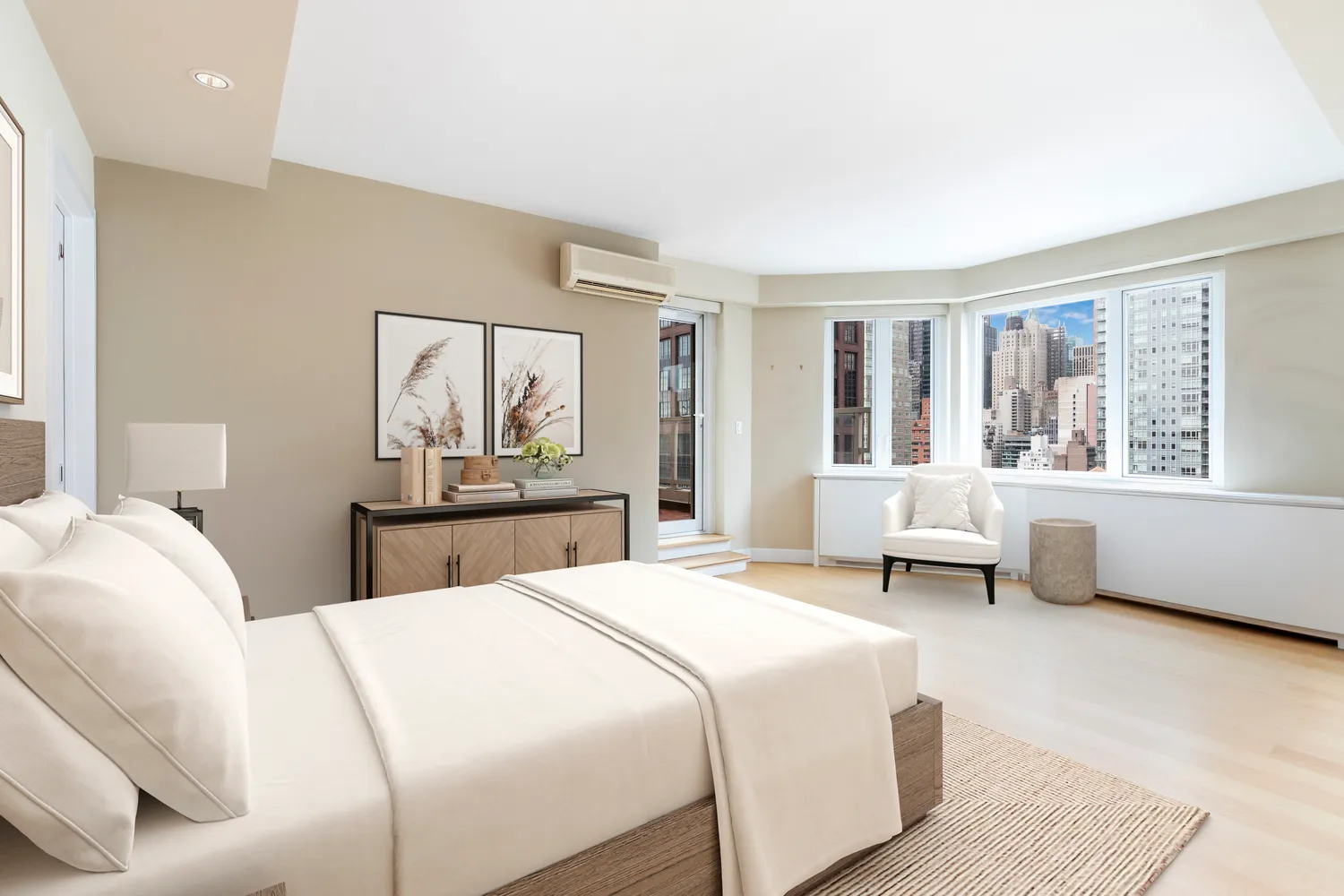 a bedroom with a large bed and a window