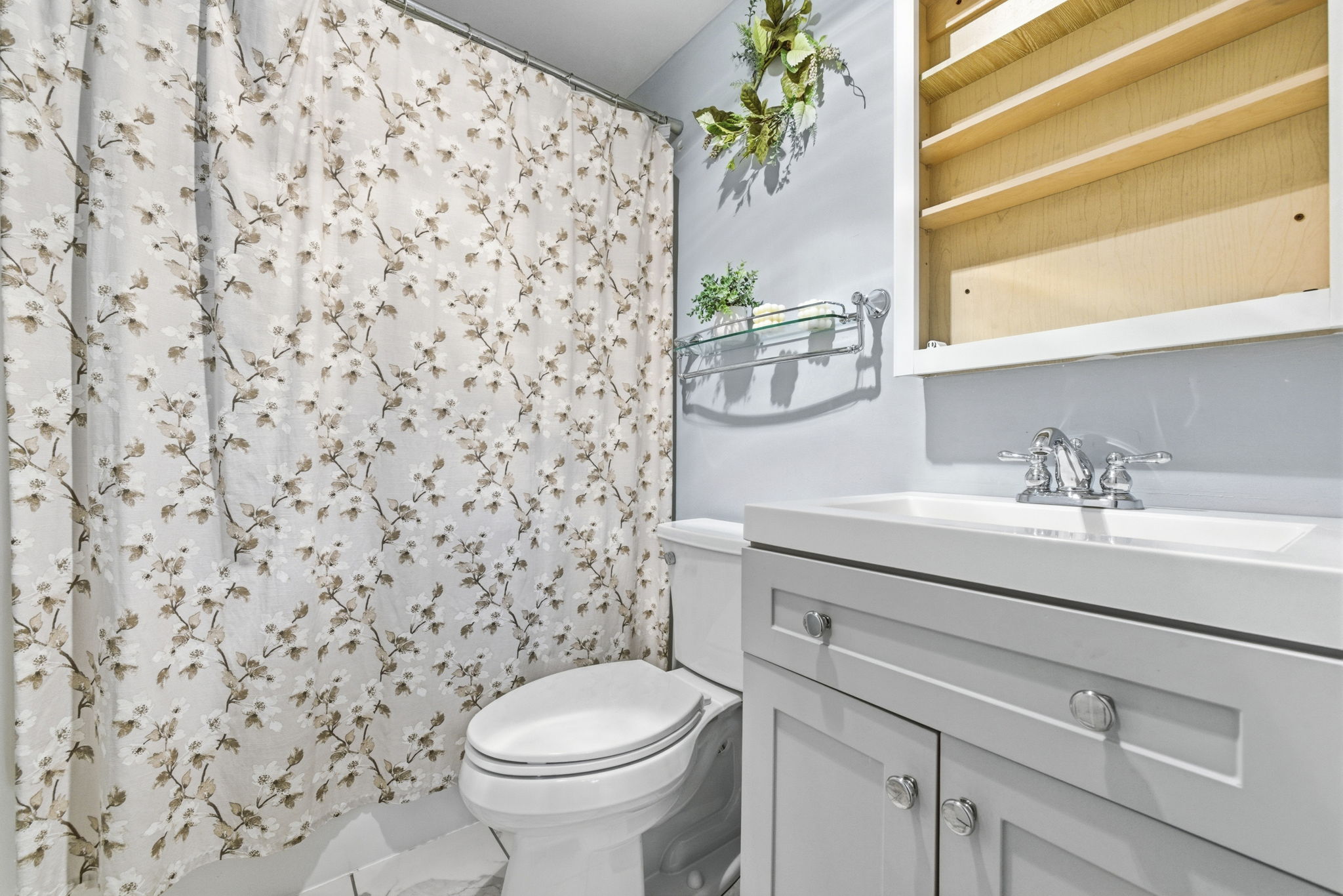 61 Wright Street, Unit 102 Stoneham, MA 02180 - Photo 18 of 26 a bathroom with a sink a toilet and a mirror