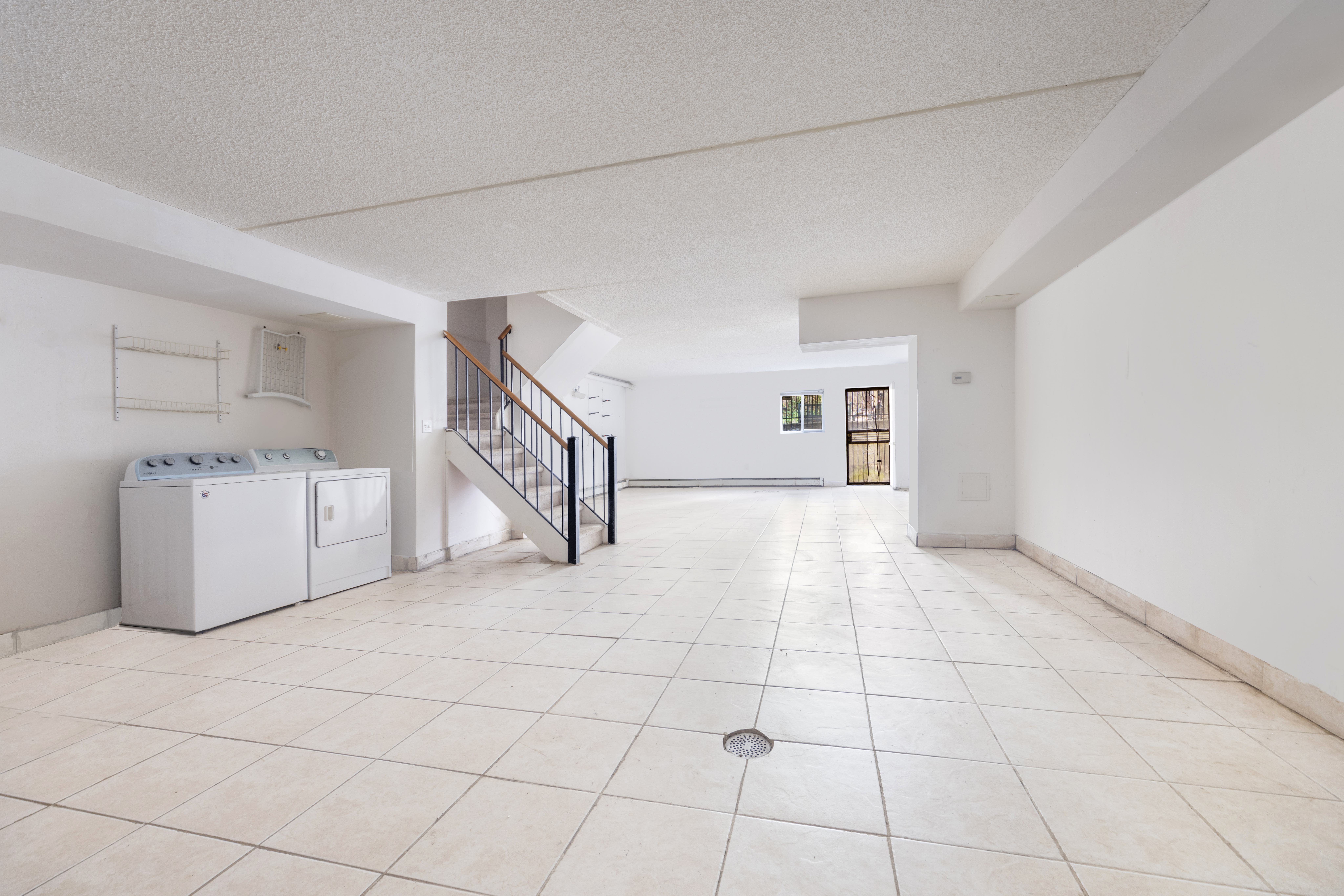 125 West 117th Street Manhattan, NY 10026 - Photo 8 of 23 a view of a livingroom with kitchen and furniture