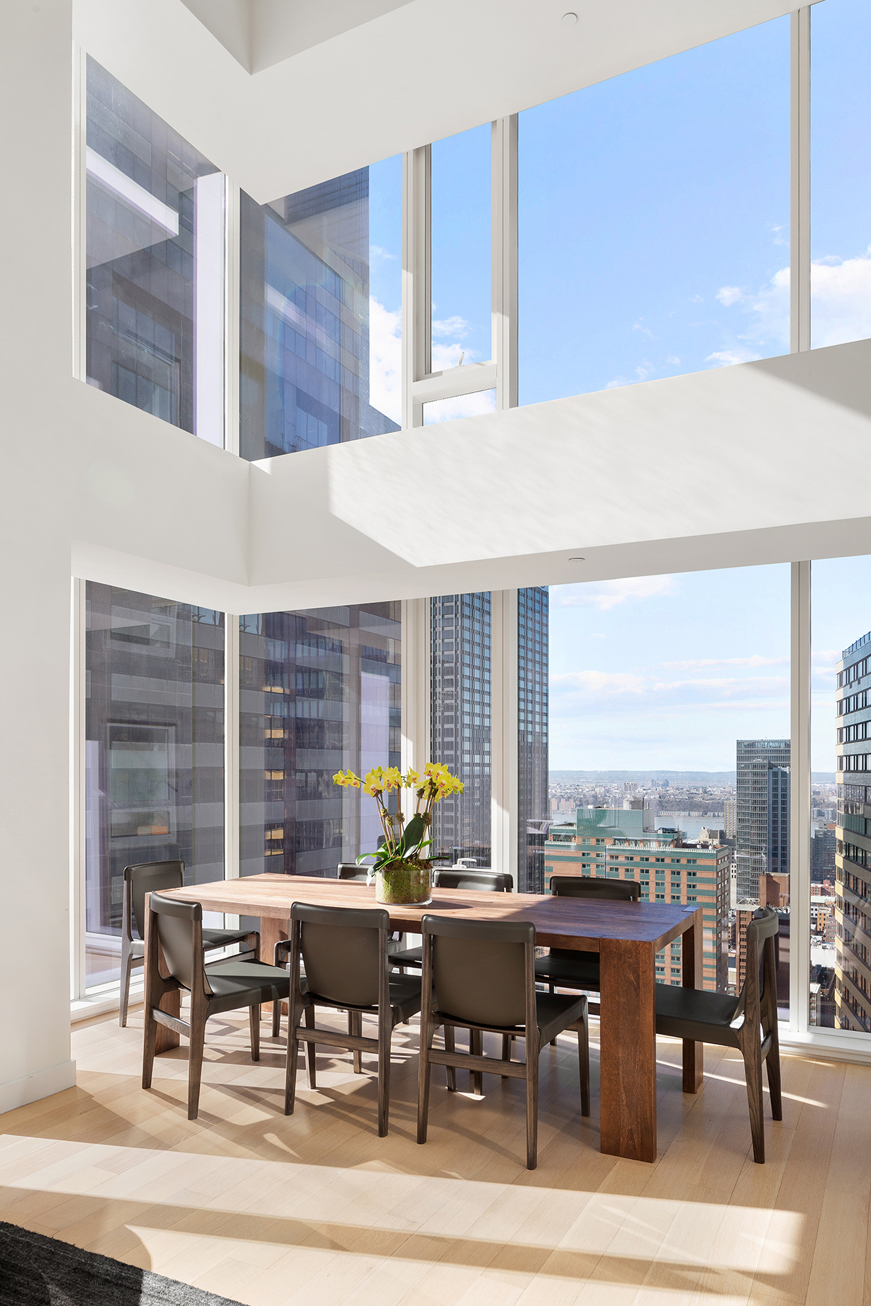 135 West 52nd Street, Unit PH3 Manhattan, NY 10019 - Photo 5 of 17 a view of a dining room with furniture window and outside view