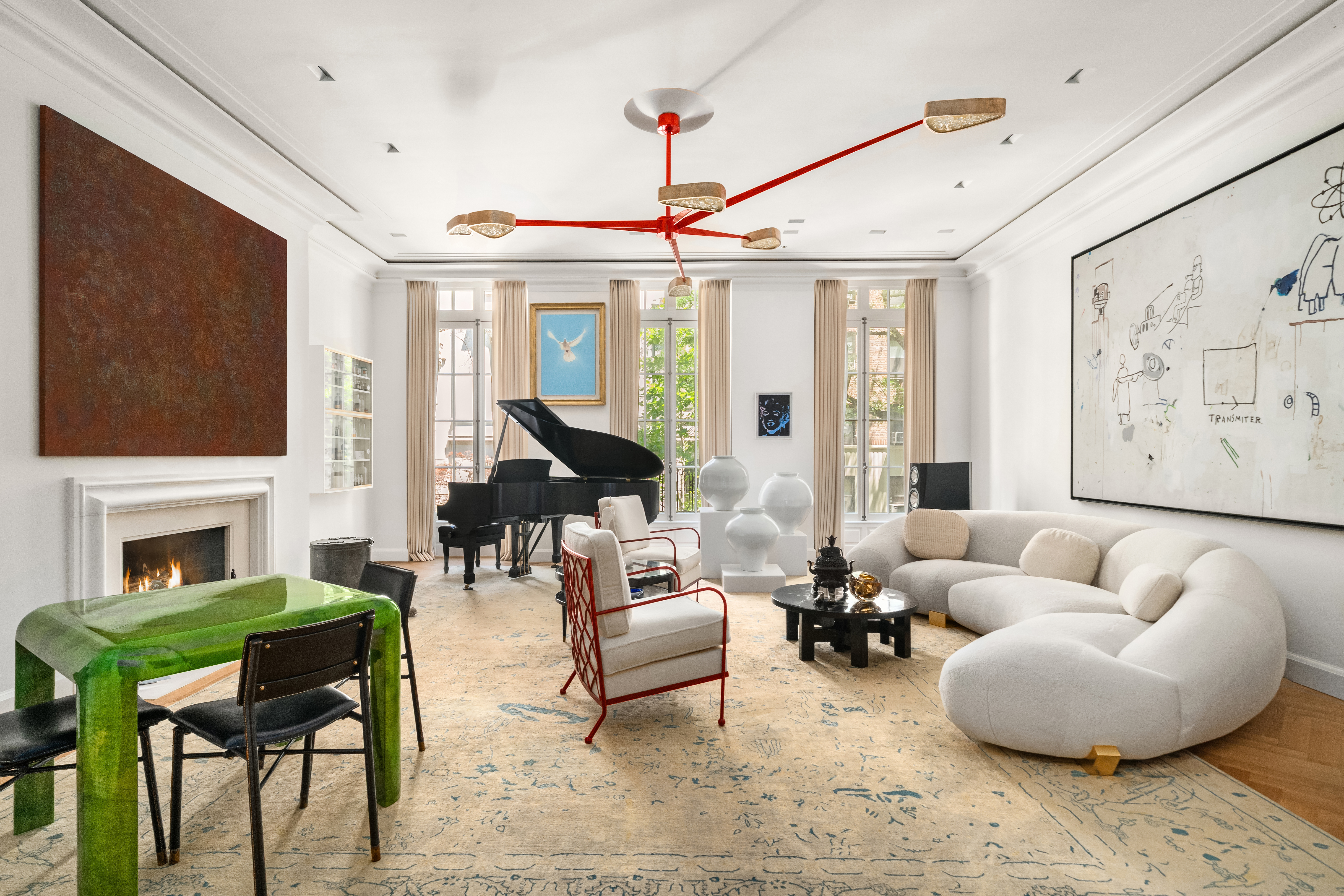 18 East 80th Street Manhattan, NY 10075 - Photo 4 of 28 a living room with furniture a fireplace and a flat screen tv