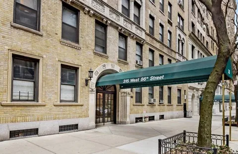 a view of a building with a porch