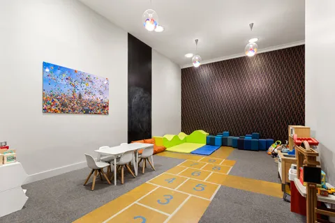 a bedroom with a bed and a table in it