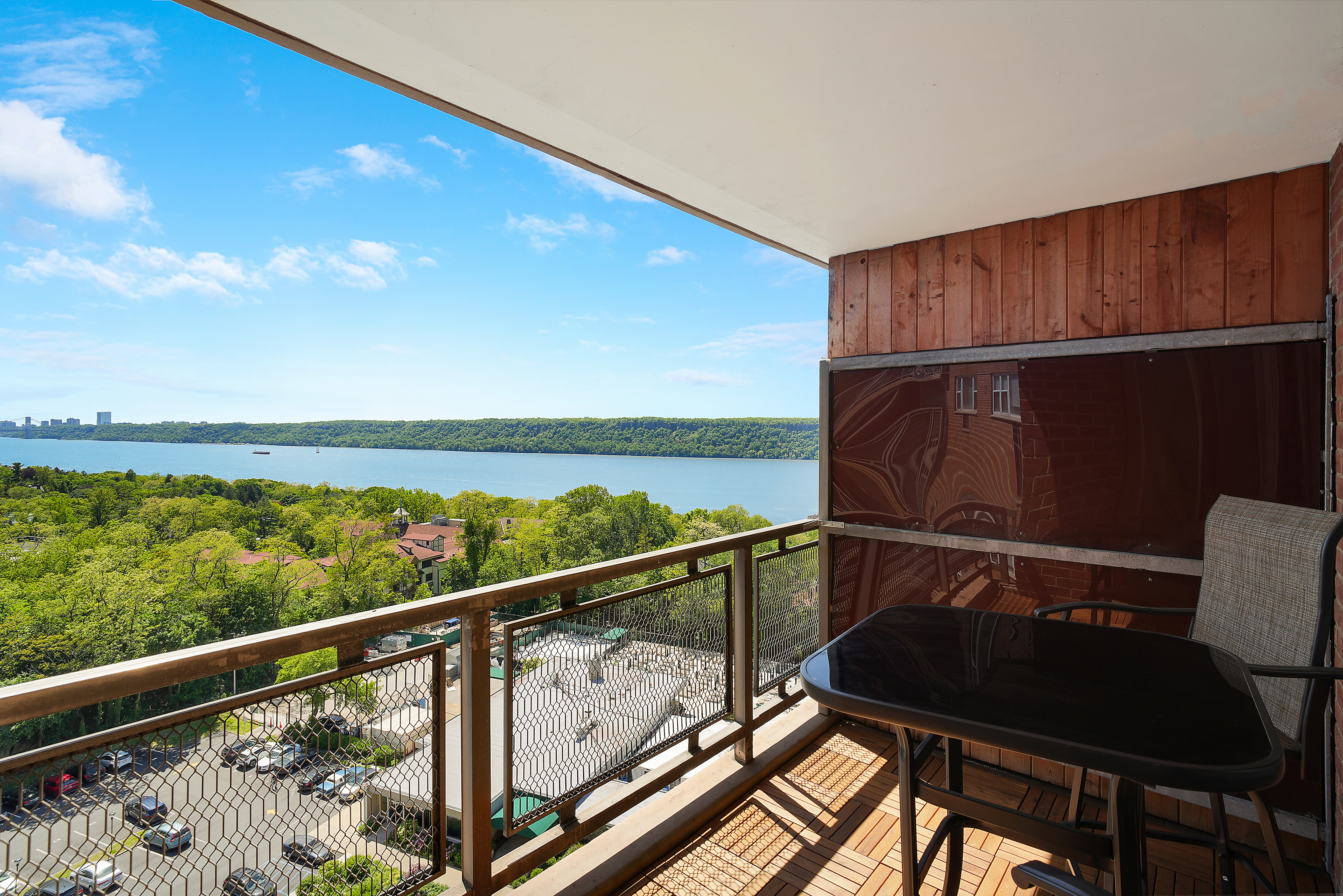5700 Arlington Avenue, Unit 16T Bronx, NY 10471 - Photo 11 of 16 a view of a chairs and table in the balcony
