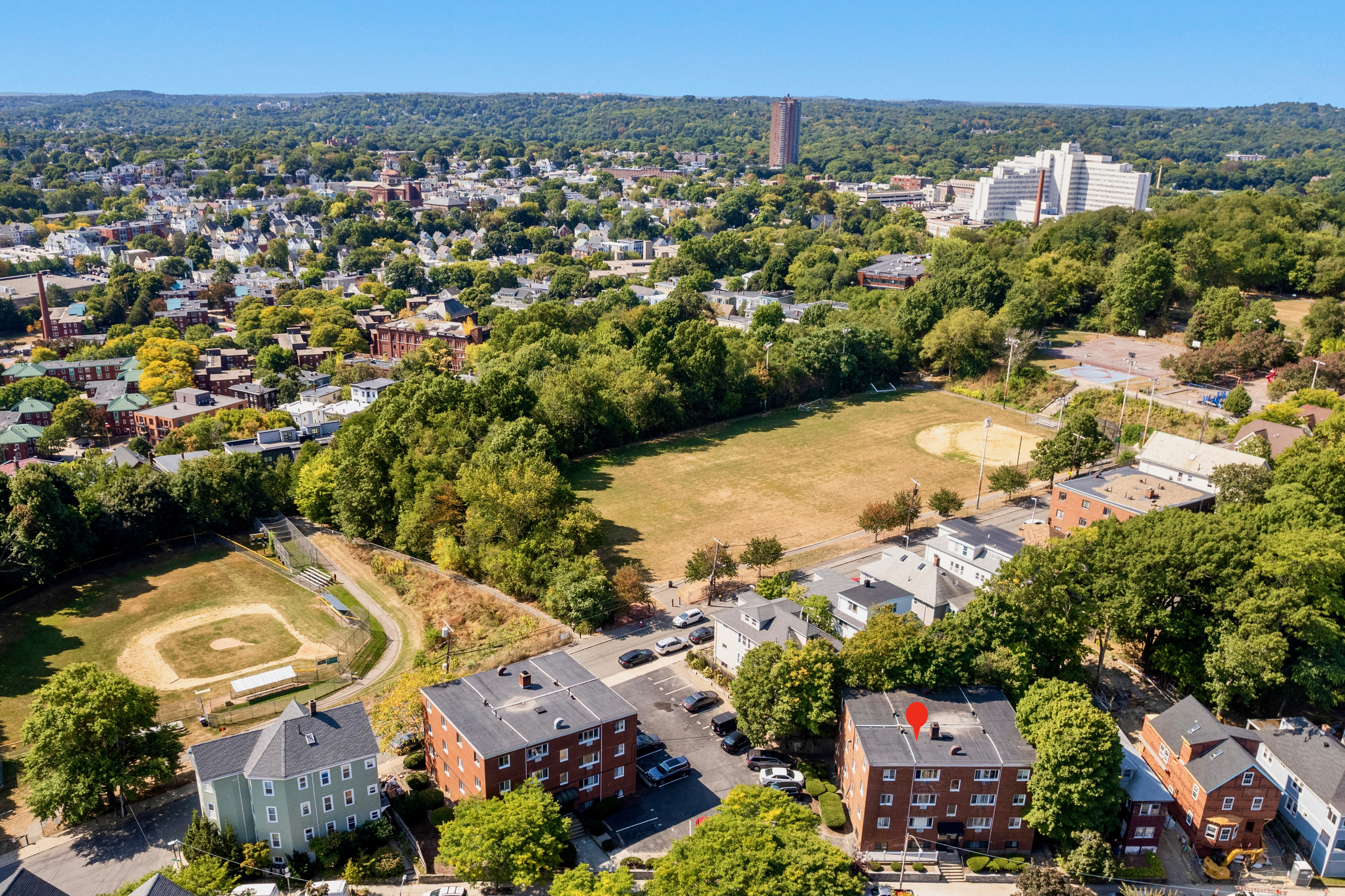 197 Calumet Street, Unit 10 Boston, MA 02120 - Photo 9 of 10 an aerial view of residential houses with outdoor space and trees