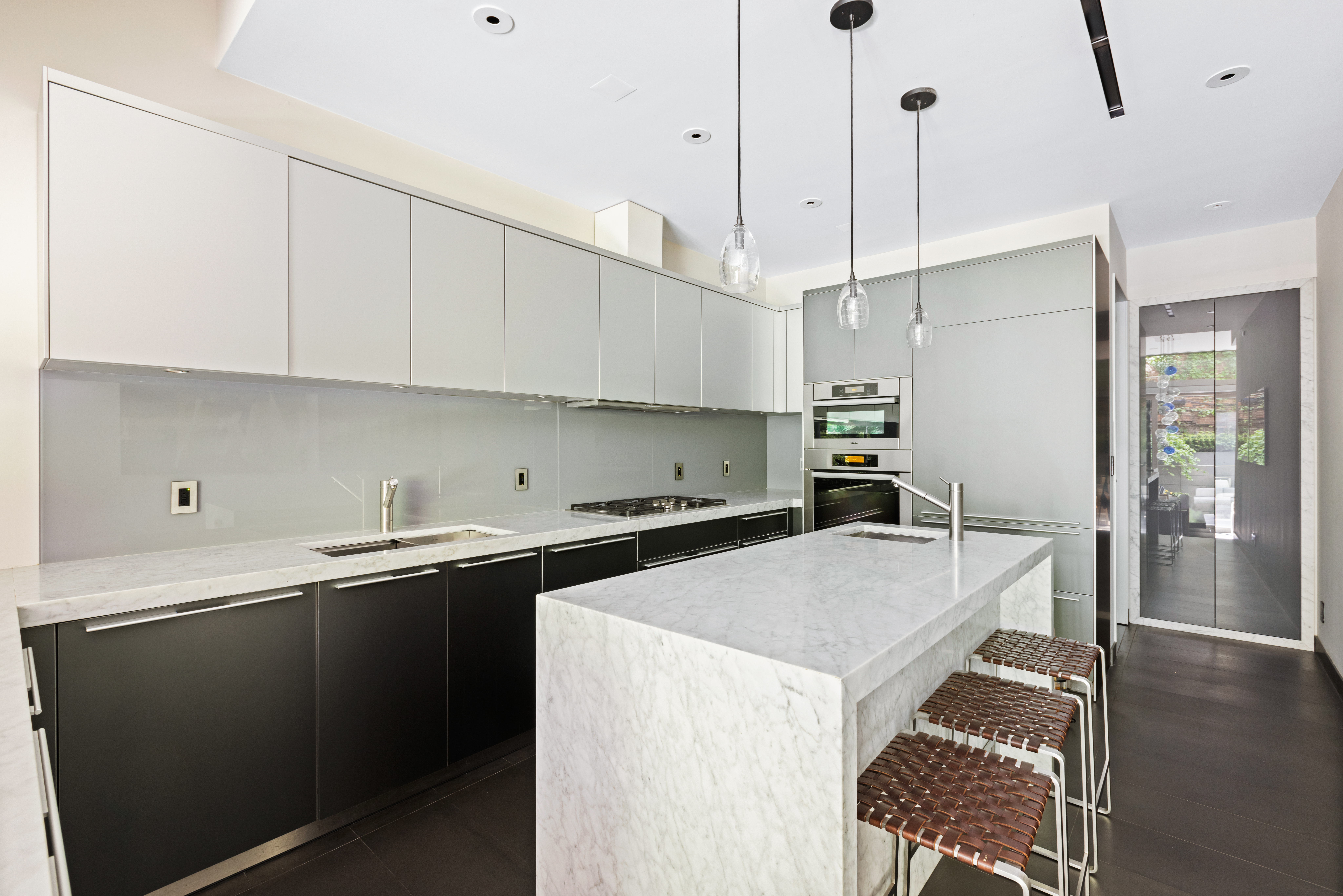 33 Vestry Street, Unit TH1 Manhattan, NY 10013 - Photo 6 of 17 a kitchen with a sink a stove and cabinets