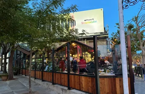 a view of an chairs and table in a patio