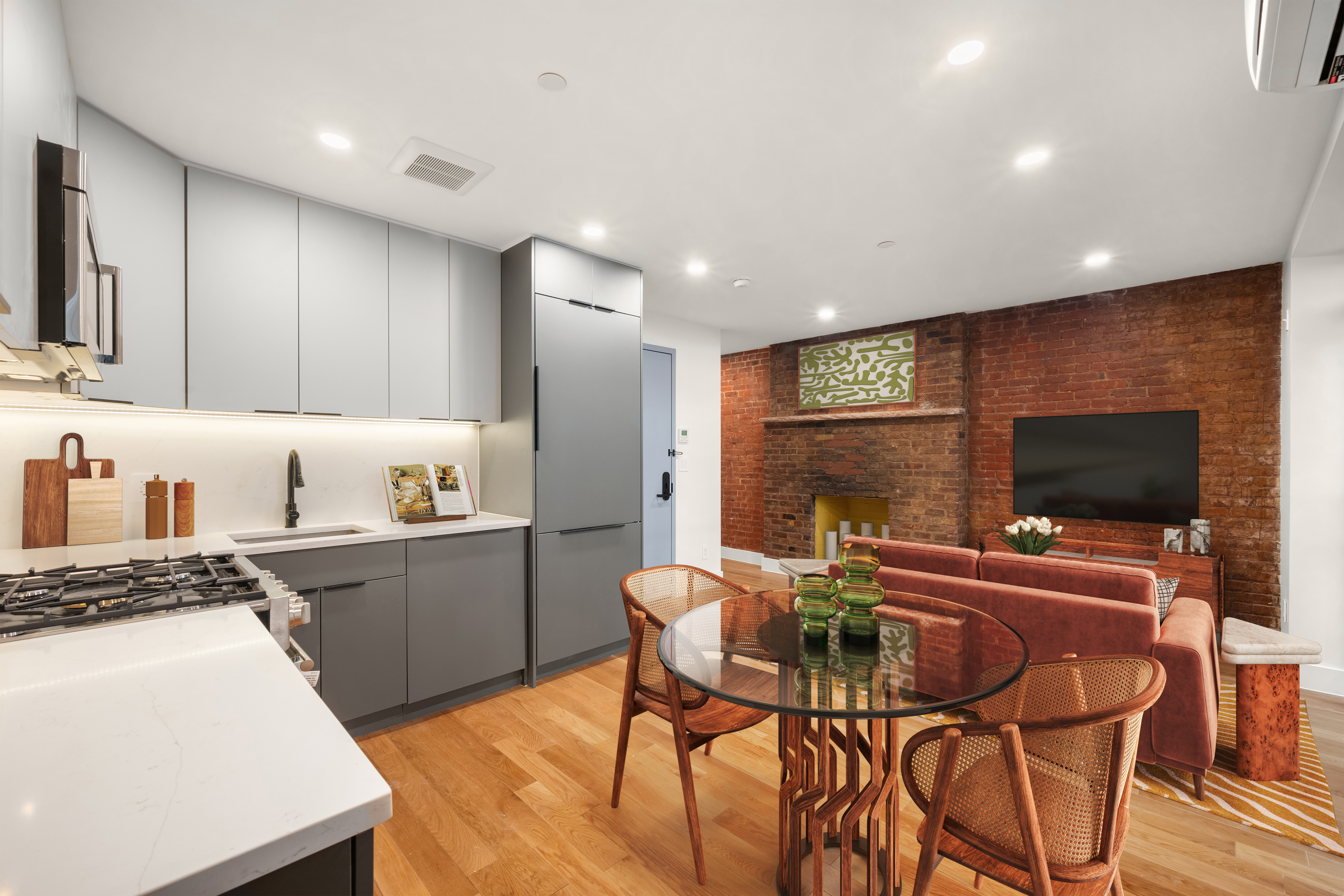 a kitchen with stainless steel appliances kitchen island granite countertop a sink and cabinets