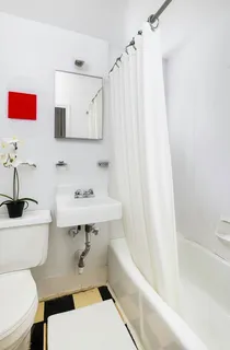 a bathroom with a sink a toilet and a bathtub