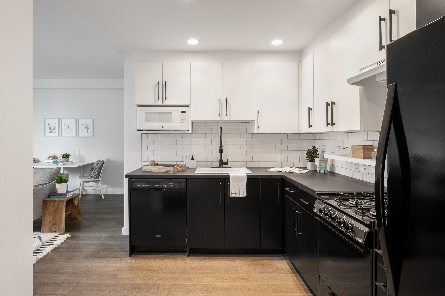 16-26 Madison Street, Unit 5A Queens, NY 11385 - Photo 3 of 16 a kitchen with stainless steel appliances granite countertop a sink stove and refrigerator