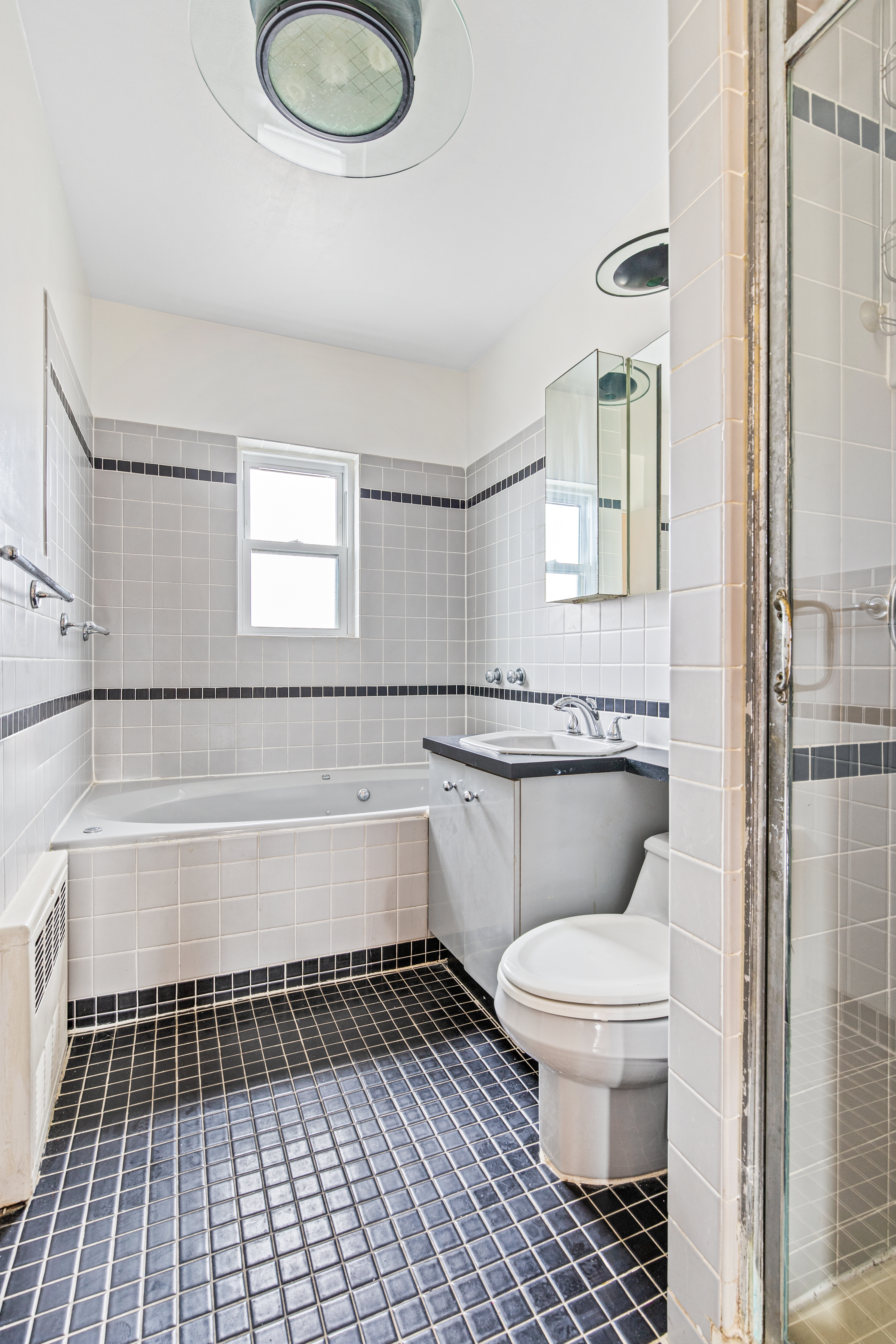 32 Tudor Terrace Brooklyn, NY 11224 - Photo 10 of 15 a bathroom with a sink a toilet and bathtub