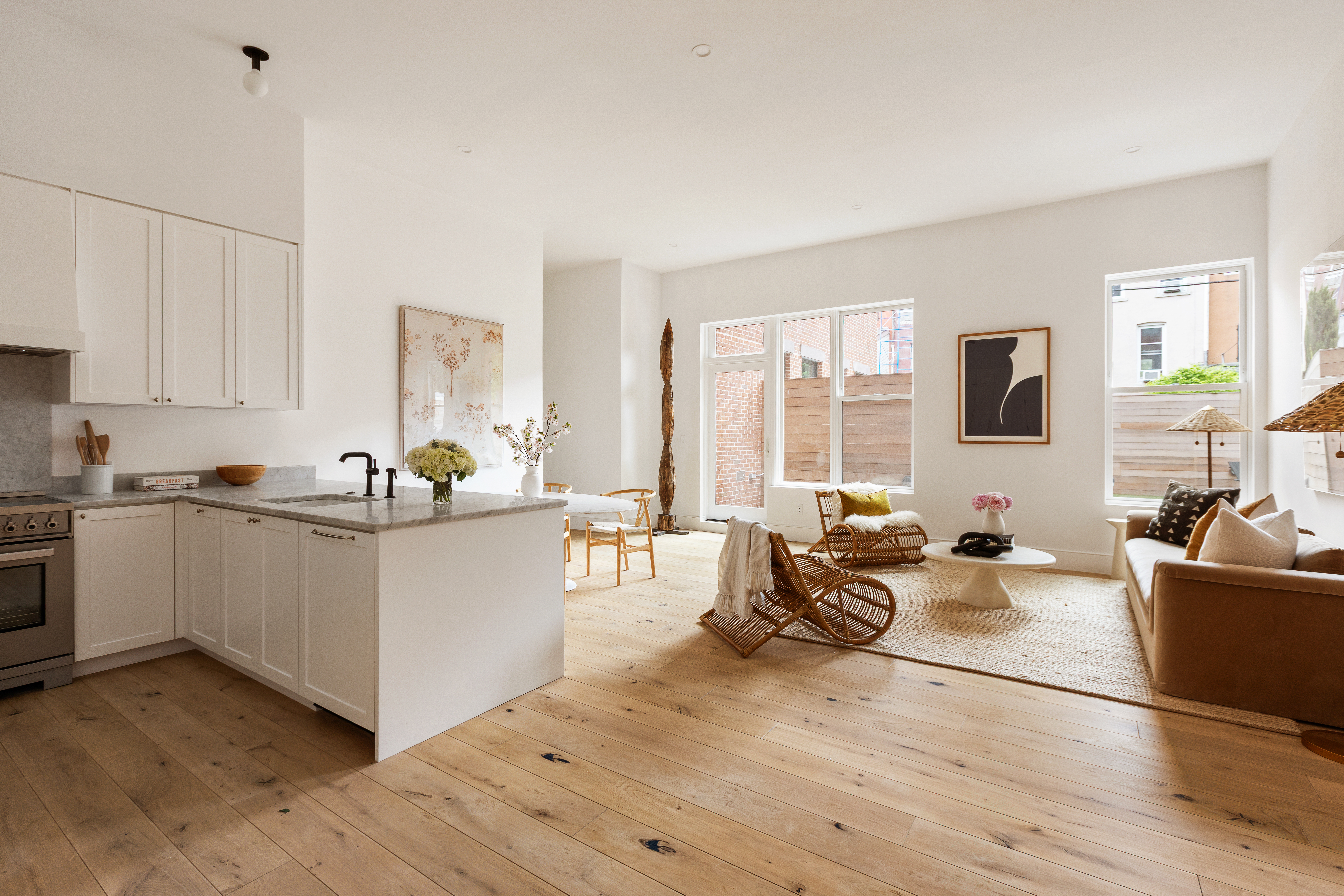 524 Halsey Street, Unit 105 Brooklyn, NY 11233 - Photo 3 of 15 a living room with furniture and large windows
