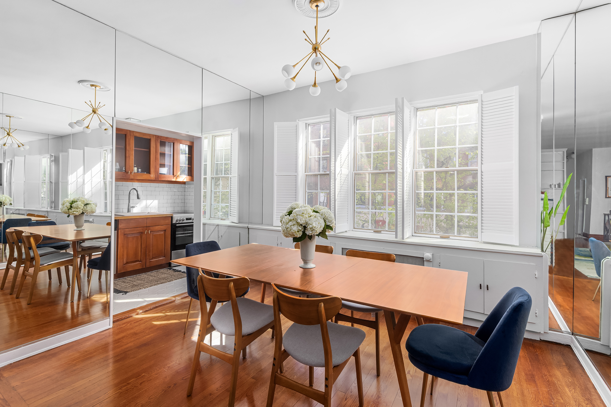 159 West 13th Street Manhattan, NY 10011 - Photo 14 of 36 a dining room with furniture a chandelier and wooden floor
