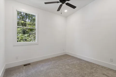 a view of a house with backyard porch and sitting area