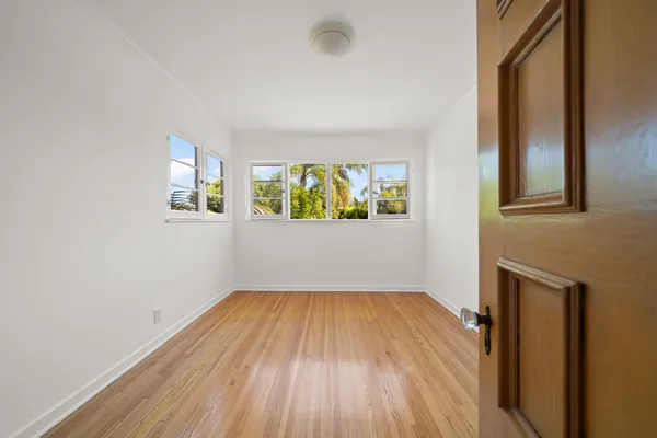 a bathroom with a toilet sink and a mirror