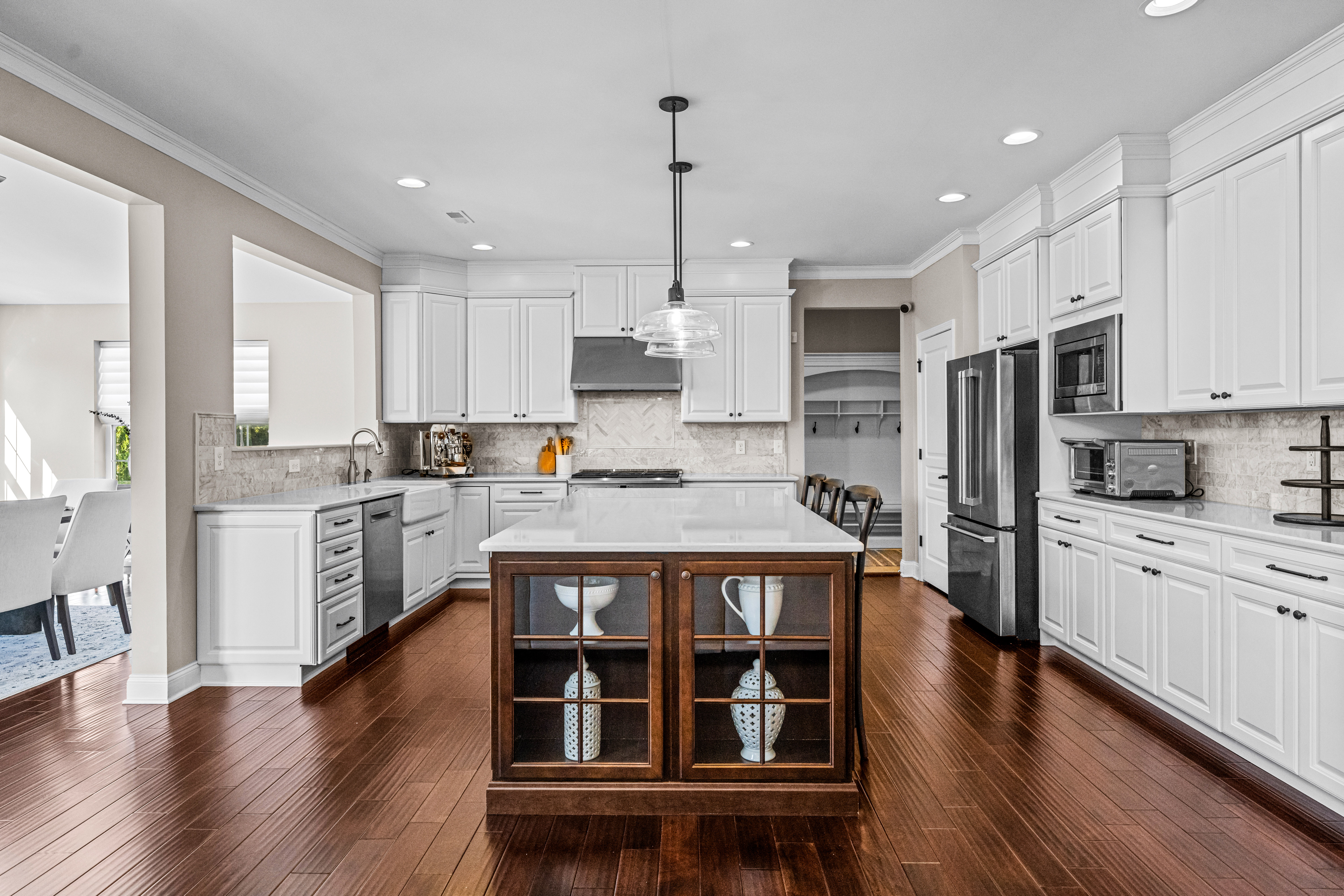 52 Wellesley Way Marlton, NJ 08053 - Photo 44 of 98 a kitchen with stainless steel appliances granite countertop a refrigerator a stove oven and white cabinets with wooden floors