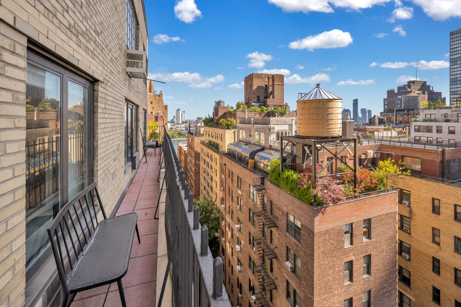a living room with a couch and a wooden floor