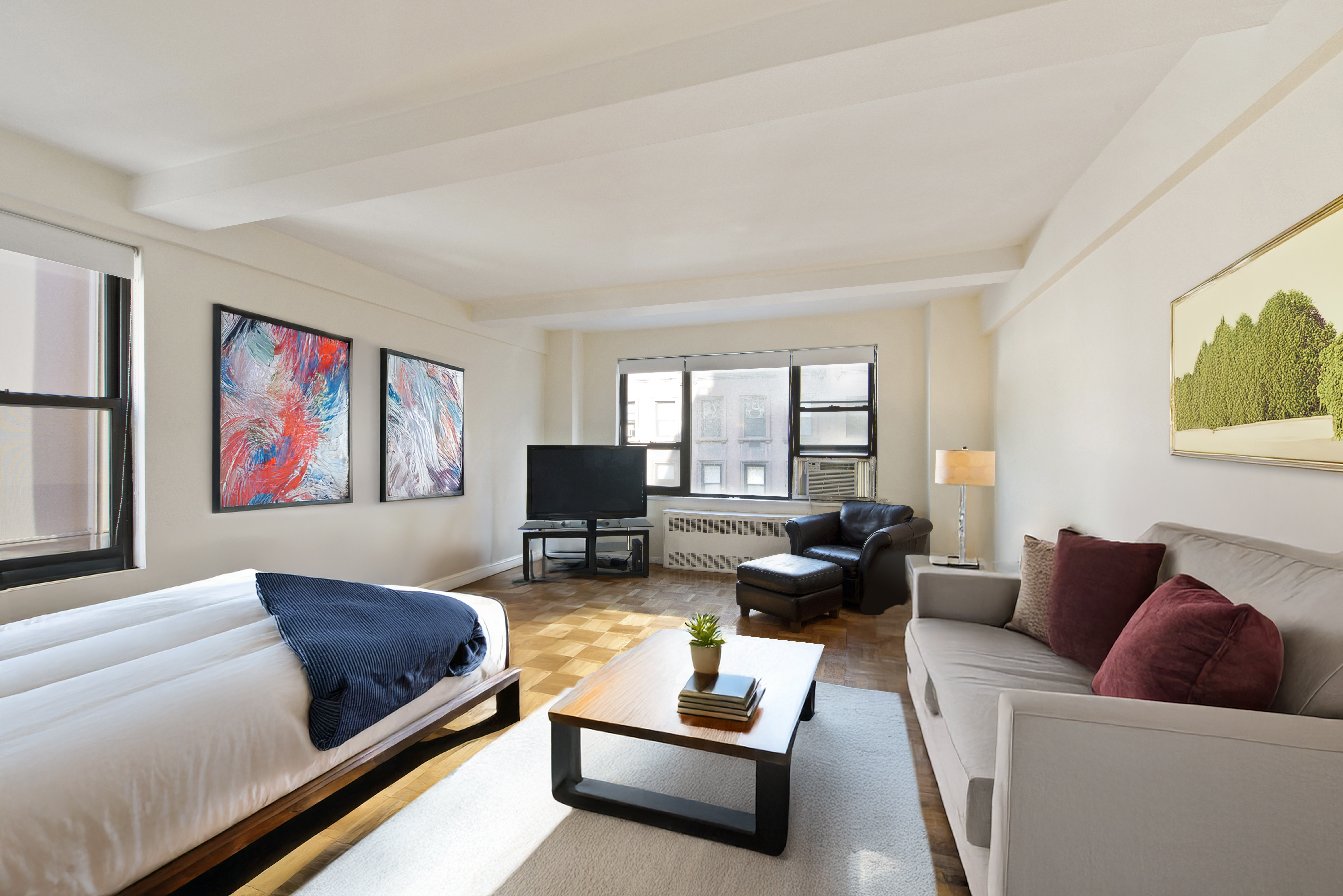 30 East 37th Street, Unit 6C Manhattan, NY 10016 - Photo 1 of 5 a living room with furniture rug and window