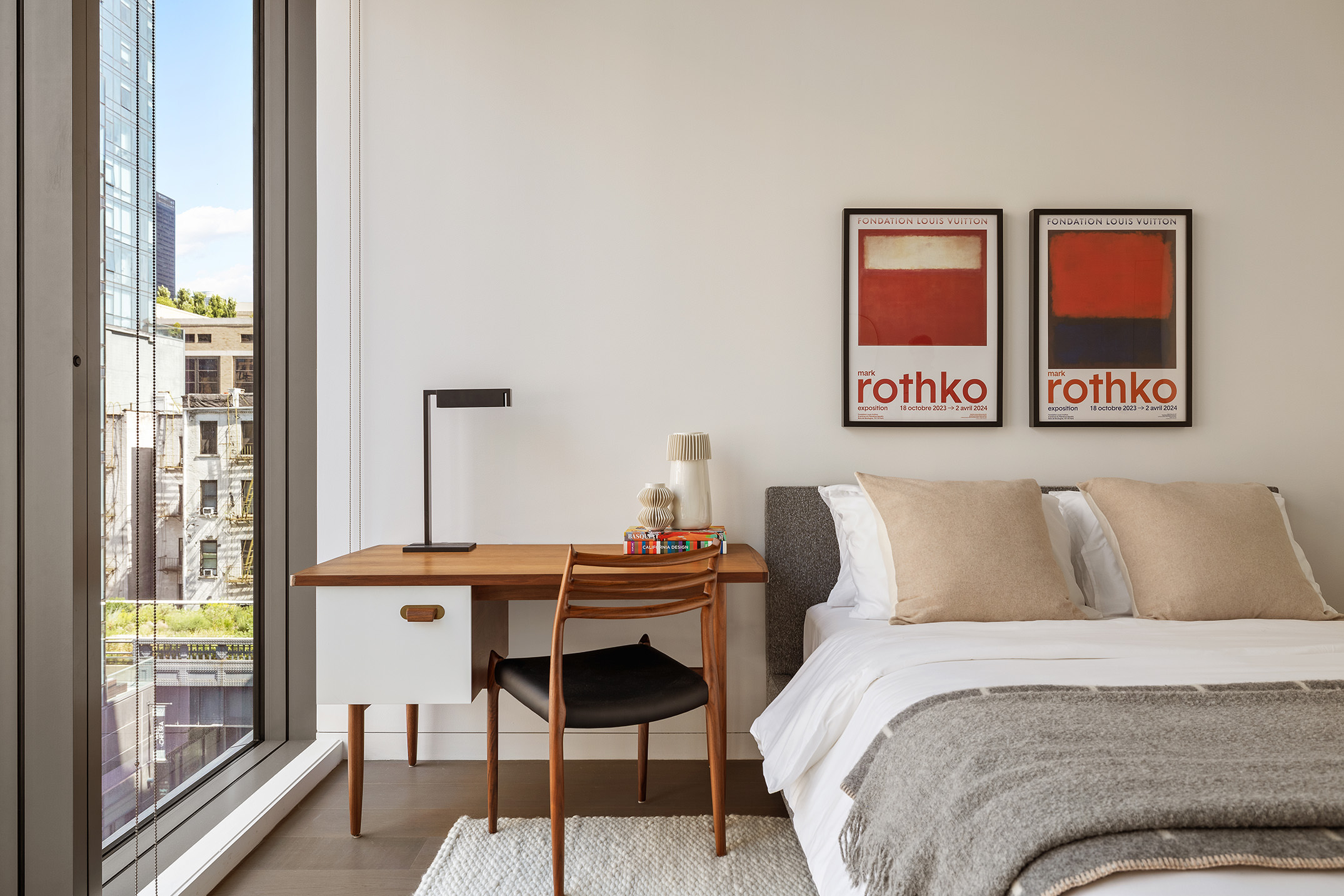 520 West 28th Street, Unit 18 Manhattan, NY 10001 - Photo 15 of 21 a bedroom with a bed and a table with chair next to a window