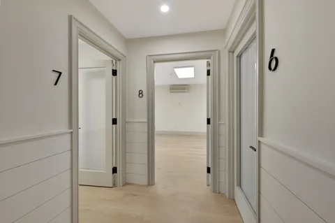 a view of a bathroom from a hallway