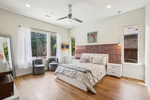 a bedroom with a large bed and a couch