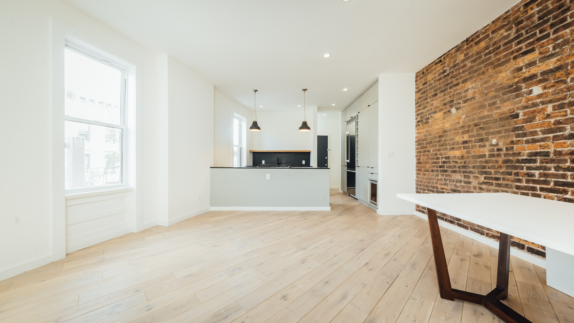 a view of a kitchen with furniture and a kitchen