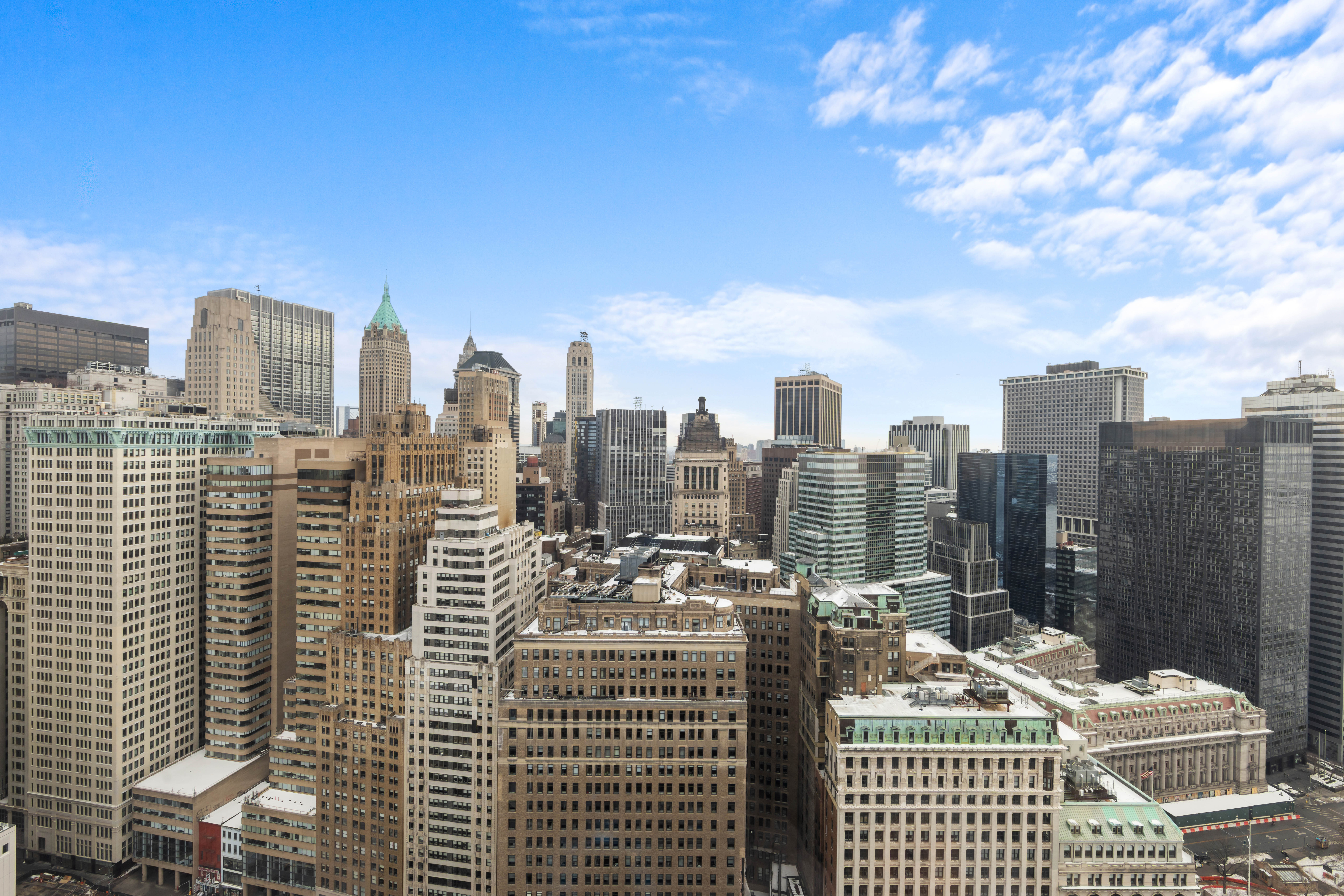 20 West Street, Unit 41D Manhattan, NY 10004 - Photo 3 of 17 a view of a city with tall buildings