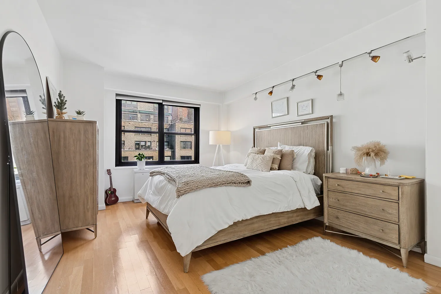 a bedroom with a large bed and a window