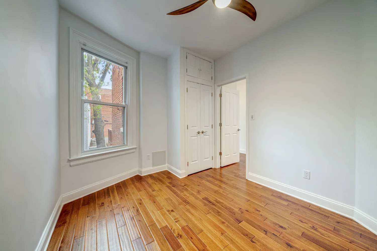 a bedroom with a bed and a lamp