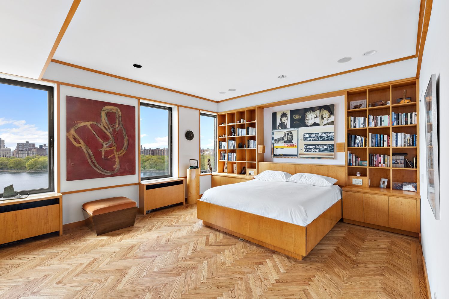 a spacious bedroom with a bed and large window