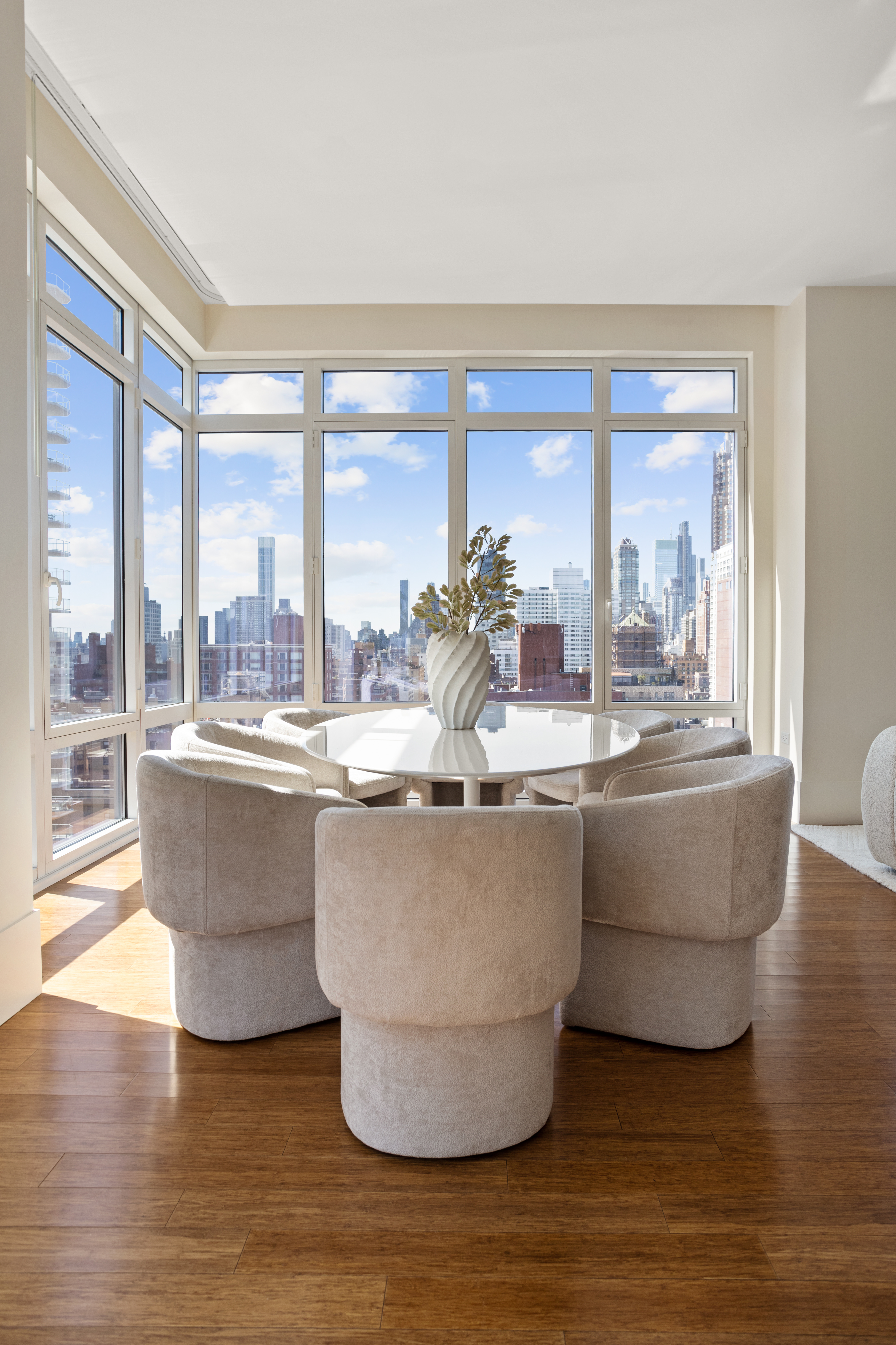 255 East 74th Street, Unit 21B Manhattan, NY 10021 - Photo 3 of 40 a living room with couch and a large window