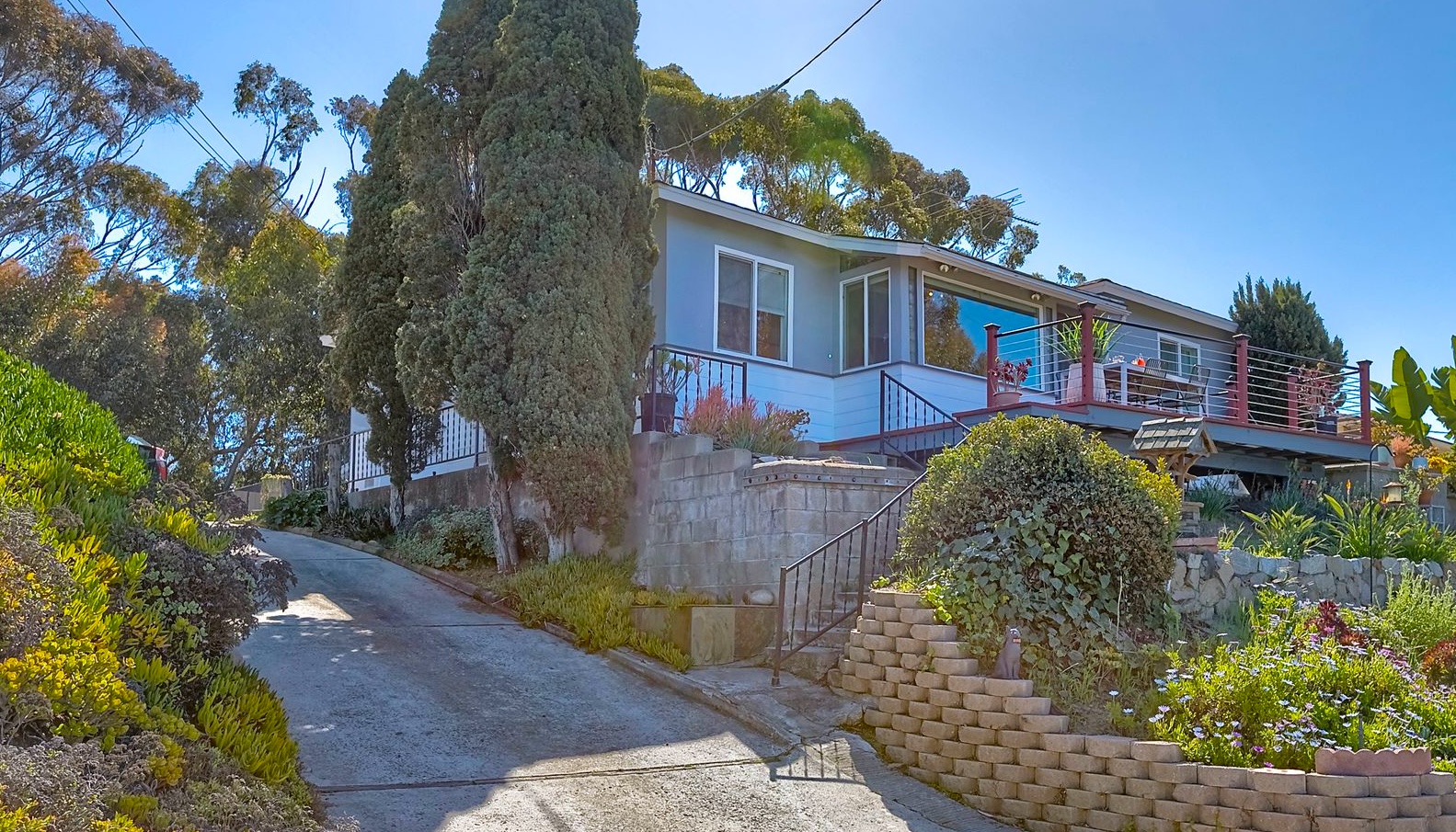 534 Hoover Street Oceanside, CA 92054 - Photo 1 of 31 a front view of a house with a garden