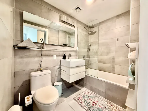 a bathroom with a toilet a sink and a bathtub
