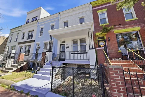 a view of a brick building with many windows