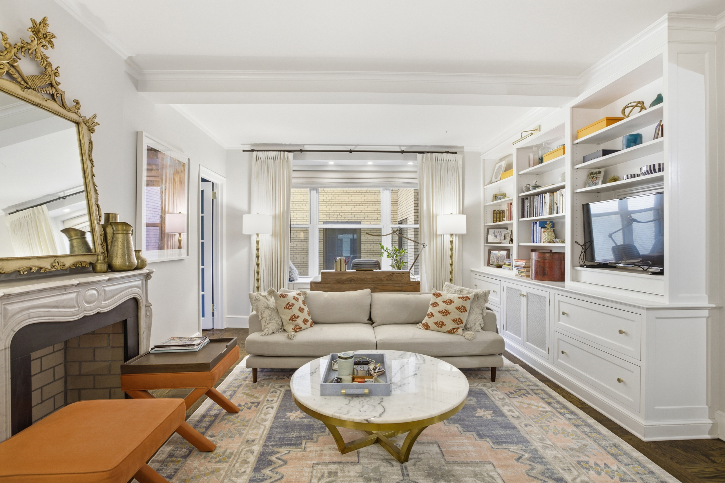 60 Gramercy Park North, Unit 8D Manhattan, NY 10010 - Photo 4 of 14 a living room with furniture fireplace and a table