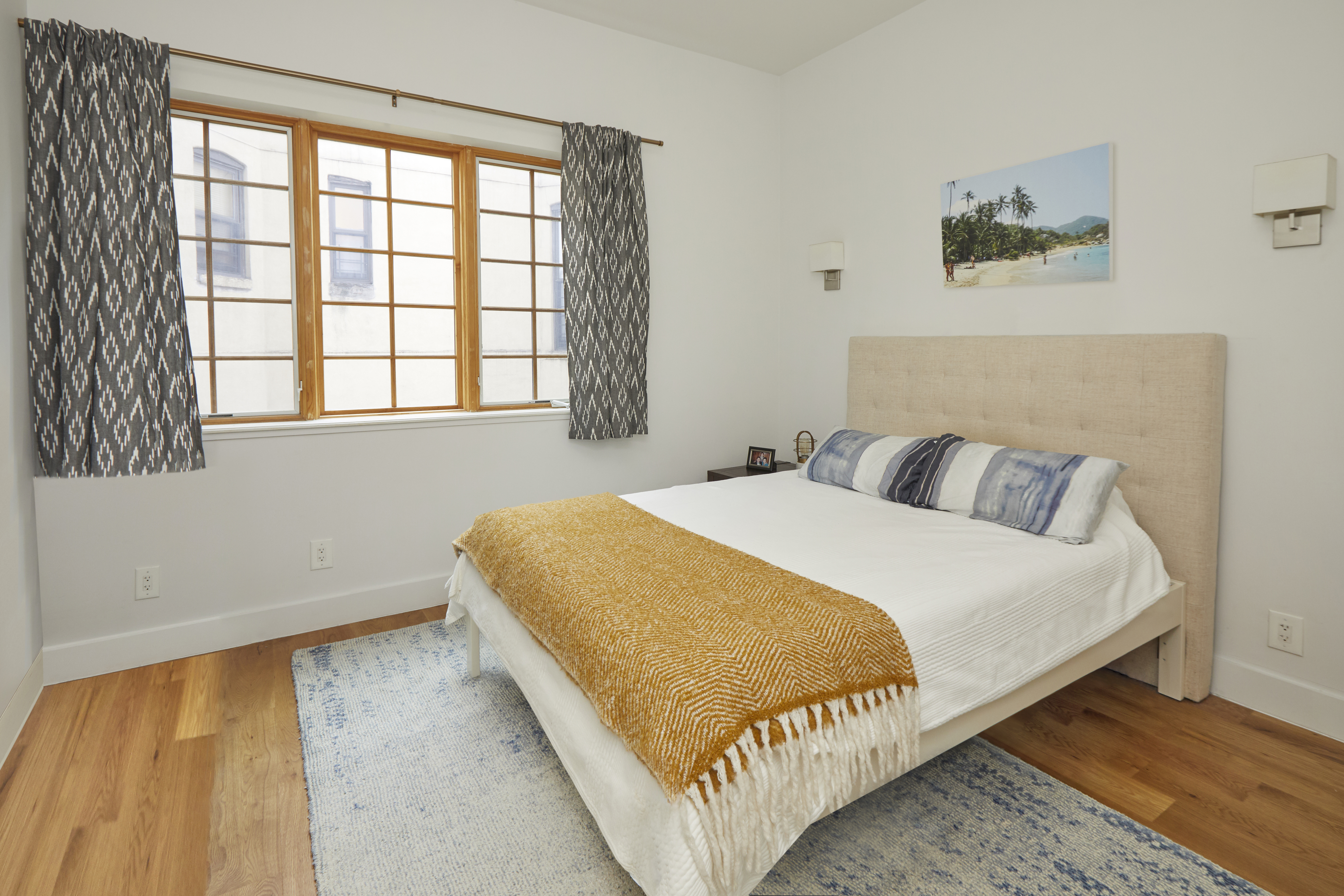 216 Pulaski Street, Unit 3R Brooklyn, NY 11206 - Photo 4 of 7 a bedroom with a bed and window