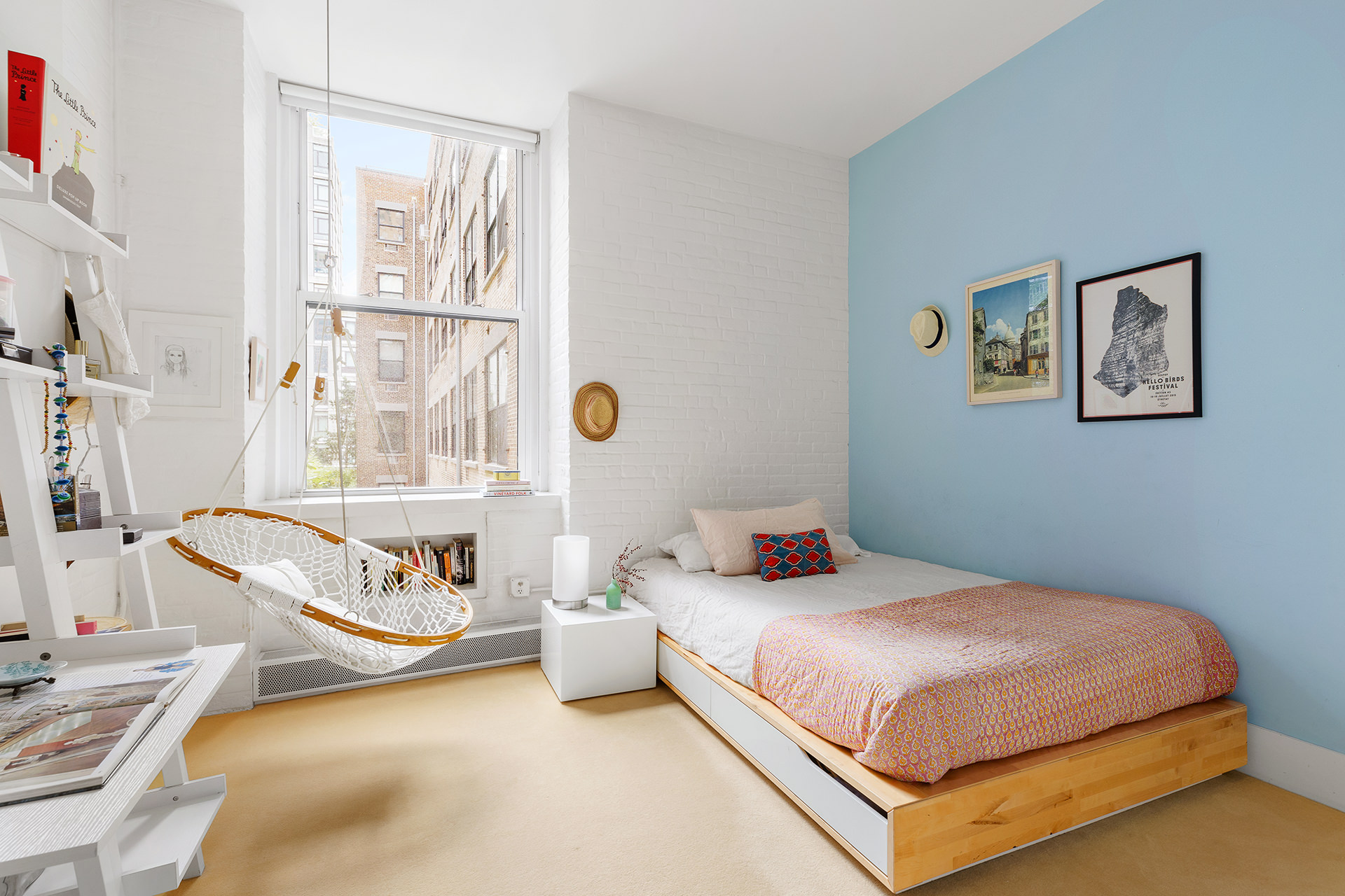 525 West 22nd Street, Unit 3AF Manhattan, NY 10011 - Photo 17 of 25 a bedroom with a bed and wooden floor