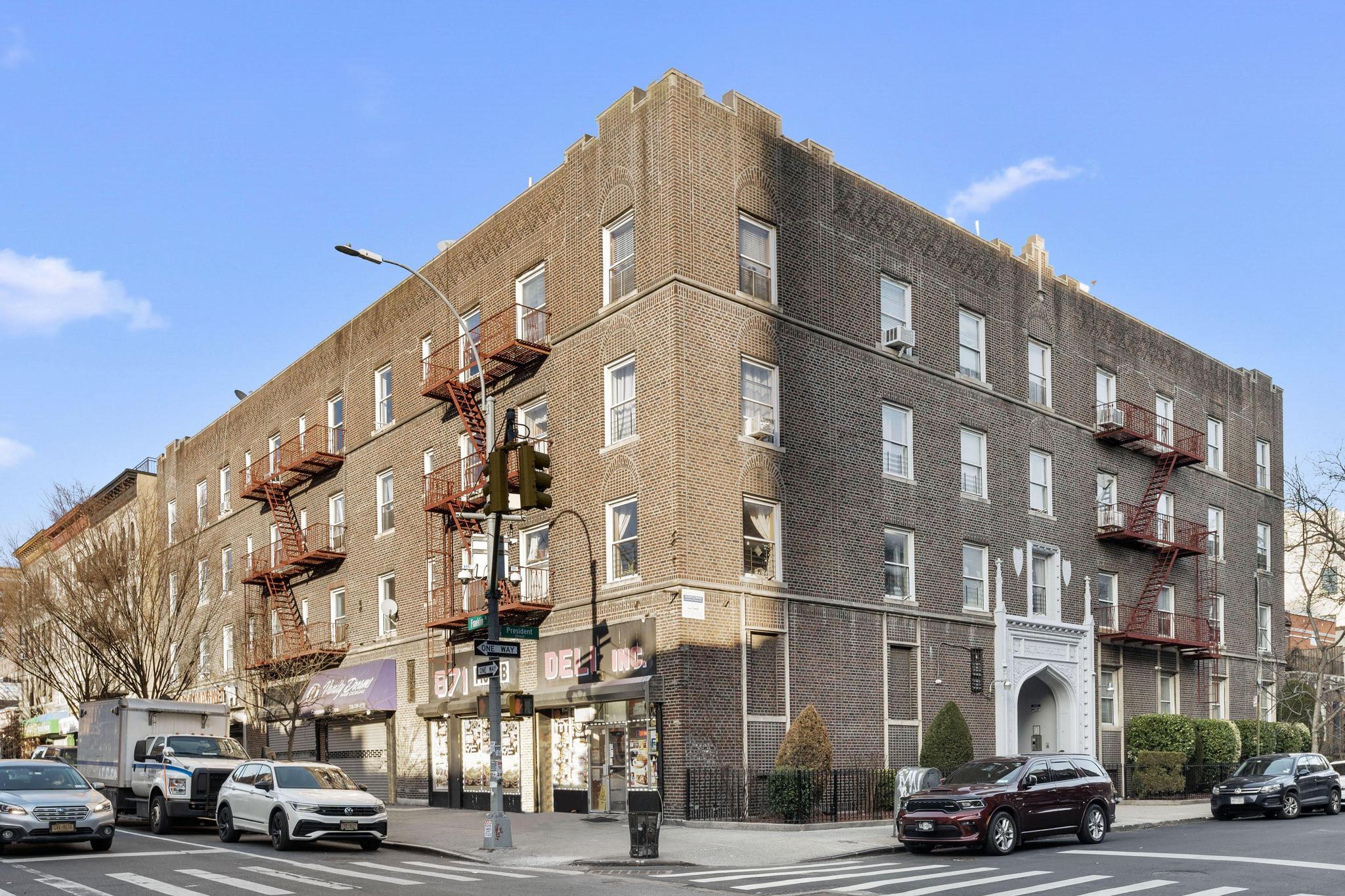 1001 President Street, Unit L2 Brooklyn, NY 11225 - Photo 1 of 3 a city street lined with buildings and cars parked on the street