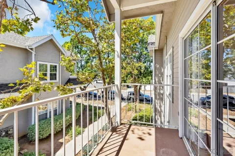 a view of a balcony with chairs