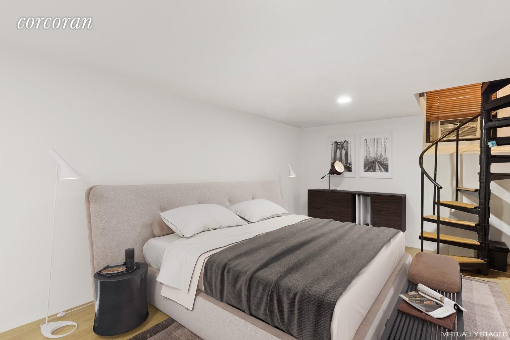 107 West 70th Street, Unit 1F Manhattan, NY 10023 - Photo 4 of 5 a bedroom with a bed and a chandelier
